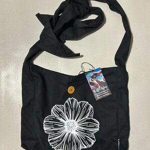 Women’s black tote bag with adjustable tie strap